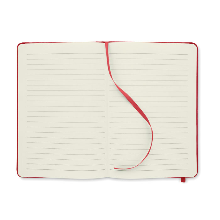 Carnet ouvert à pages lignées avec ruban rouge