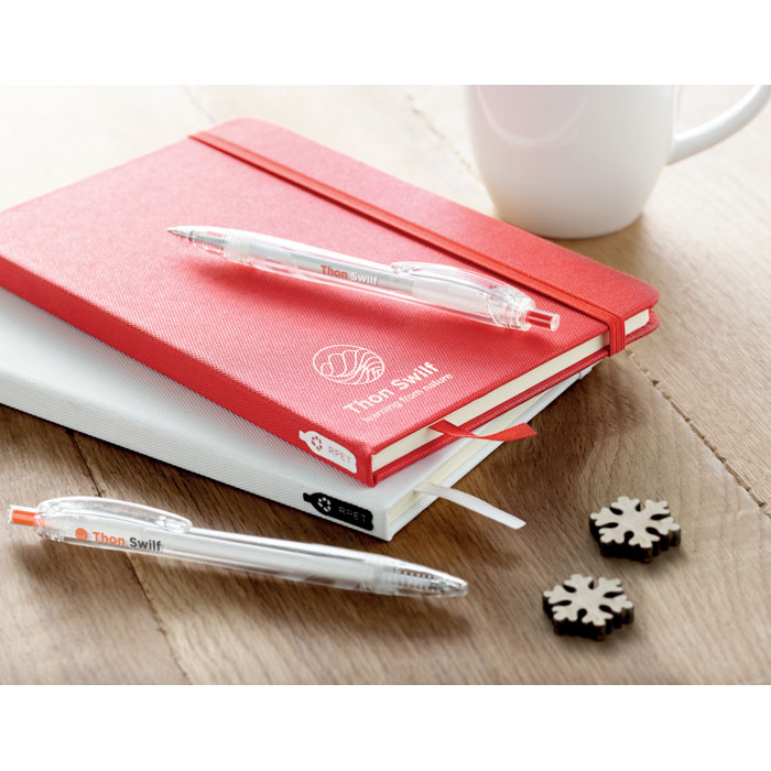 Carnets rouges et blancs avec stylos transparents