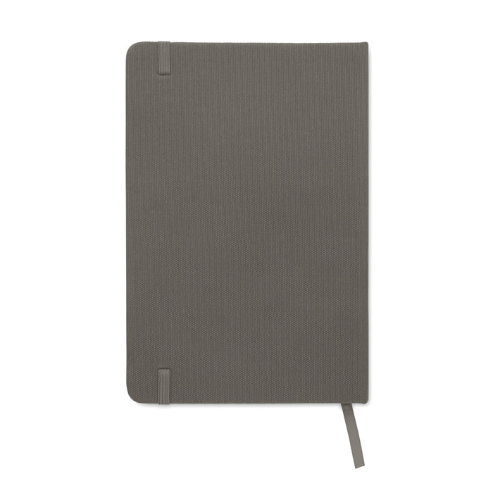 Carnet gris fermé avec élastique et ruban.