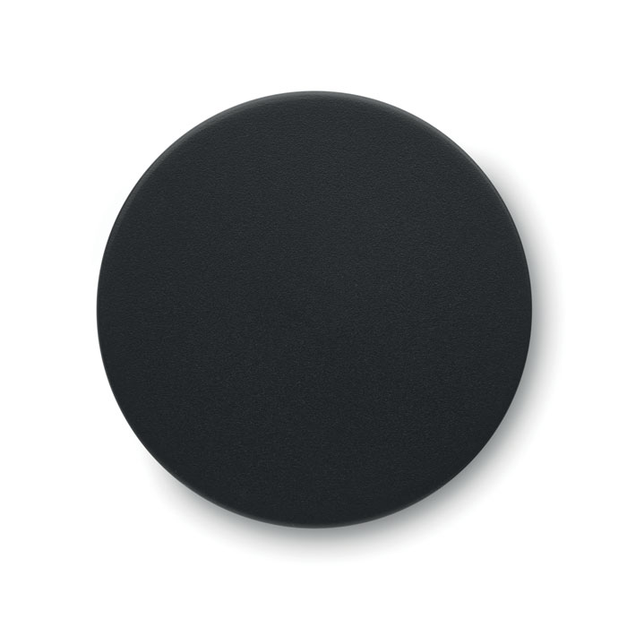 Couvercle rond noir sur fond blanc