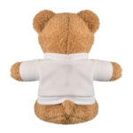 Ourson en peluche vu de dos, veste blanche.