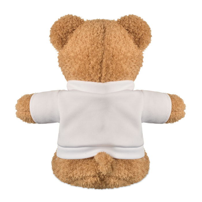 Ourson en peluche vu de dos, veste blanche.