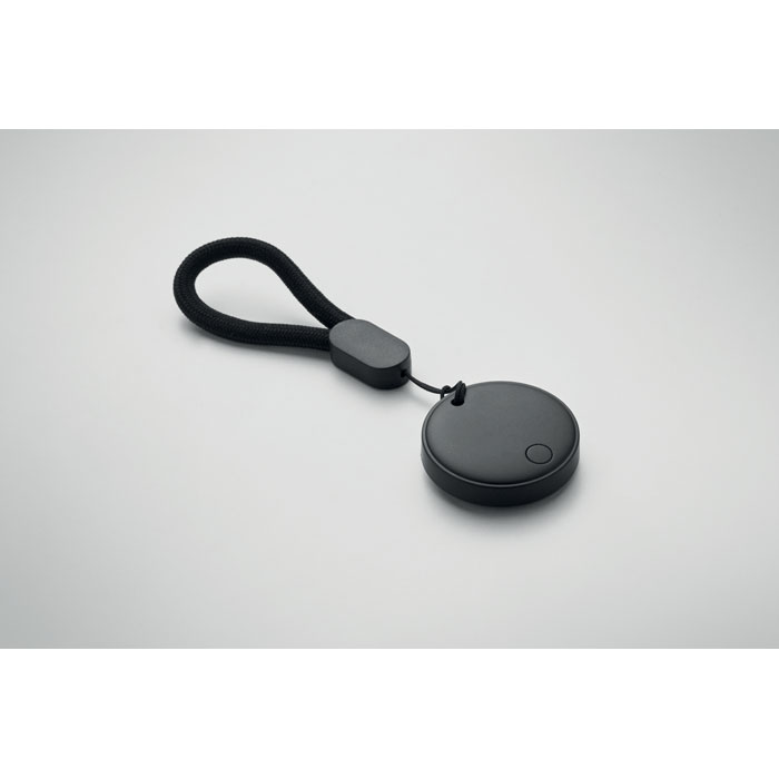 Petite télécommande noire avec cordon attaché