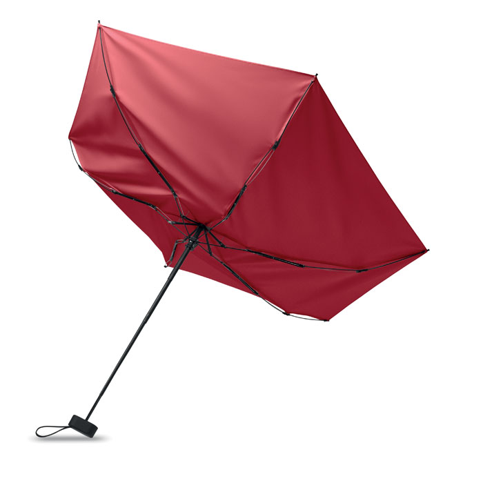 Parapluie rouge retourné par le vent