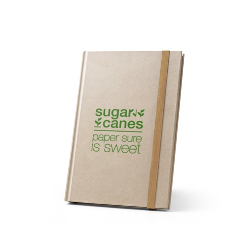 Carnet beige avec élastique et texte vert