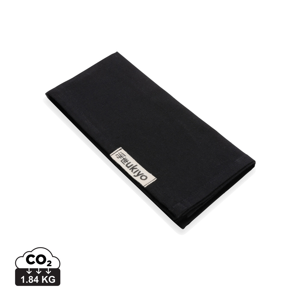 Serviette en tissu noire pliée avec étiquette