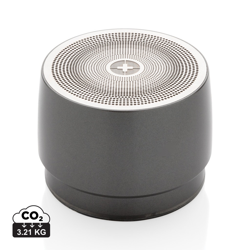 Petit haut-parleur cylindrique gris avec grille perforée