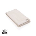 Serviette beige pliée avec étiquette Ukiyo
