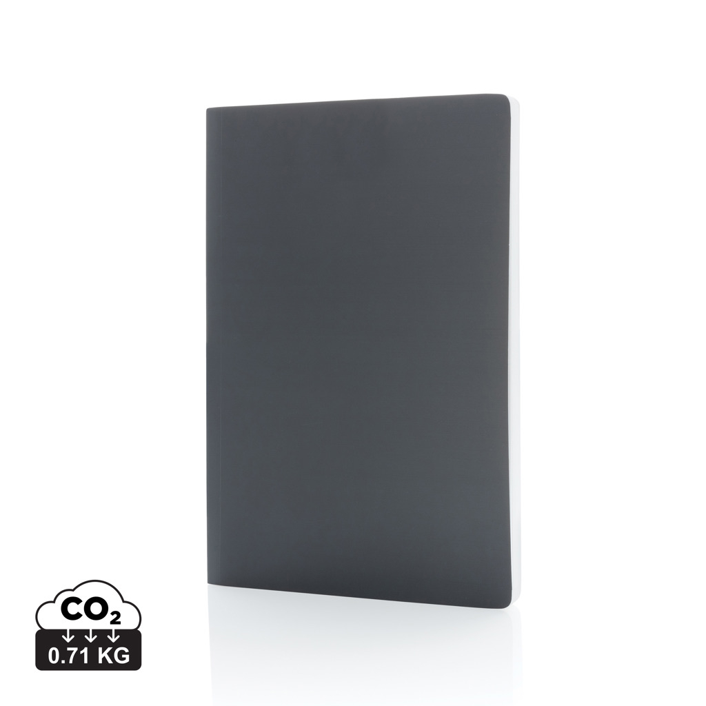 Carnet gris foncé posé sur fond blanc