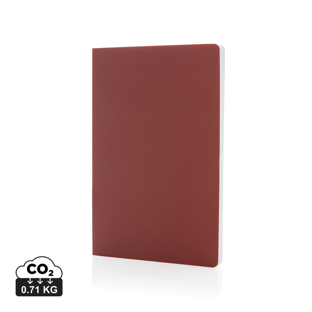 Carnet rouge minimaliste sur fond blanc