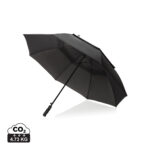 Parapluie noir ouvert sur fond blanc